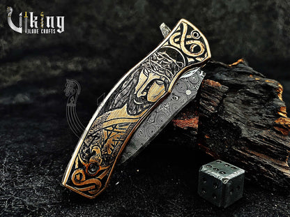 Damascus steel Folding knife with Jesus Crucifixion carved handle.