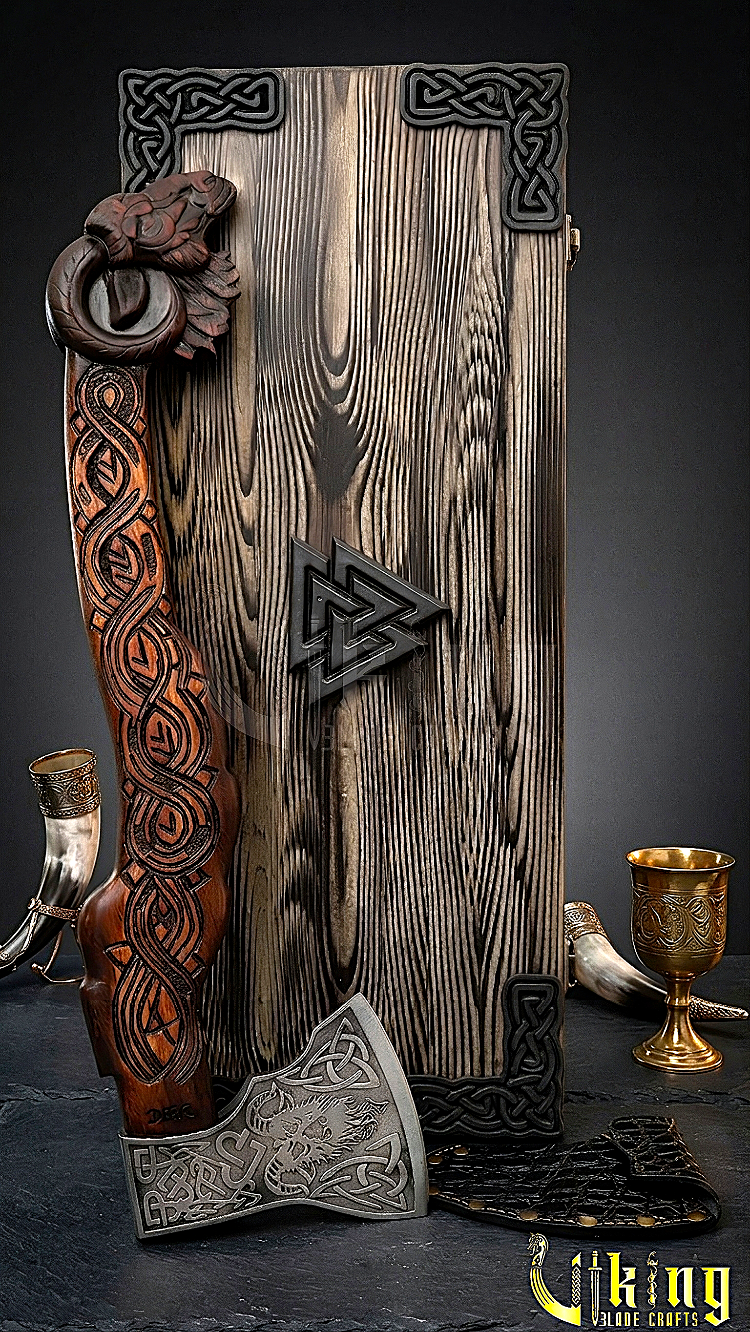 Norse Hrafn axe with detailed wood carving and steel blade