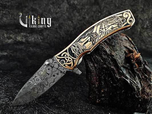 Damascus steel Folding knife with Jesus Crucifixion carved handle.