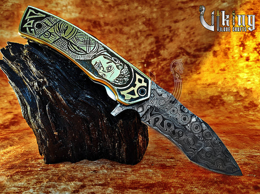 Handmade Damascus Folding Knife with Ivar the Boneless Carving Handle.