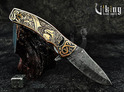 Damascus steel Folding knife with Jesus Crucifixion carved handle.