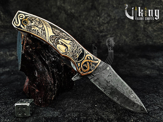 Damascus steel Folding knife with Jesus Crucifixion carved handle.