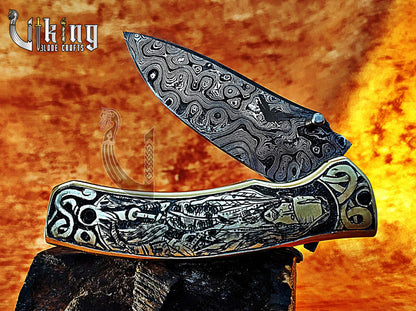Damascus steel folding knife with Pirates of the Caribbean carved handle