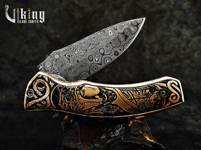 Damascus steel Folding knife with Jesus Crucifixion carved handle.