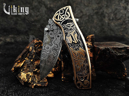 Damascus steel Folding knife with Jesus Crucifixion carved handle.