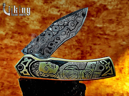 Handmade Damascus Folding Knife with Ivar the Boneless Carving Handle.