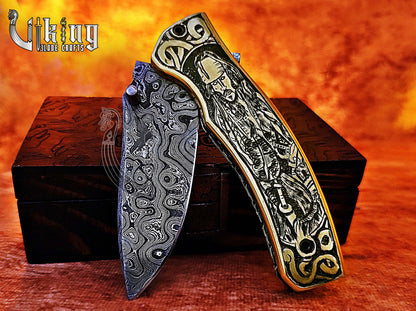 Damascus steel folding knife with Pirates of the Caribbean carved handle