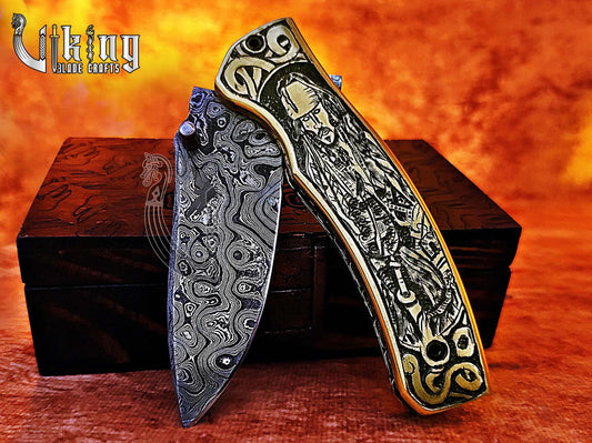 Damascus steel folding knife with Pirates of the Caribbean carved handle Viking_Blade_Crafts