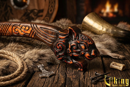 forged steel Viking axe with detailed squirrel carving