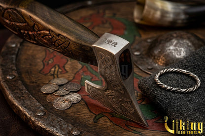 forged steel axe with custom hand carved wolf design