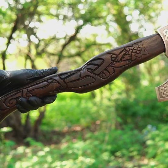 hand carved Viking axe with wolf head handle and forged steel blade