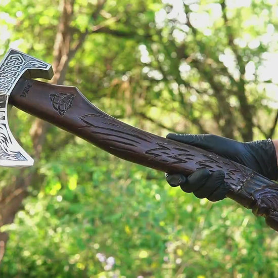Huginn Muninn Viking axe with hand carved raven handle and forged steel blade