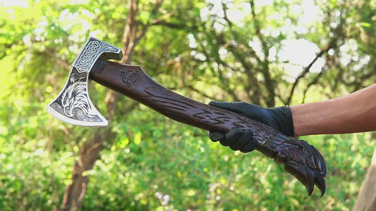 Huginn Muninn Viking axe with hand carved raven handle and forged steel blade